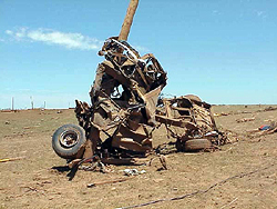 A truck wrapped around a utility pole in the aftermath of the 1999 Oklahoma tornado